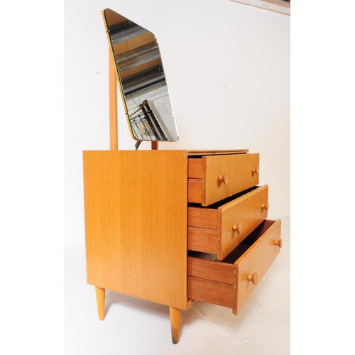 600 - Meredew - A vintage 1960's 20th century oak veneered dressing table / chest / drawers by Meredew. Or... 