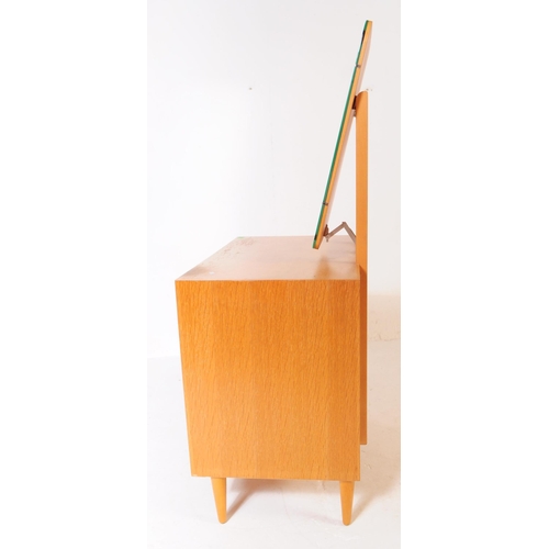 600 - Meredew - A vintage 1960's 20th century oak veneered dressing table / chest / drawers by Meredew. Or... 