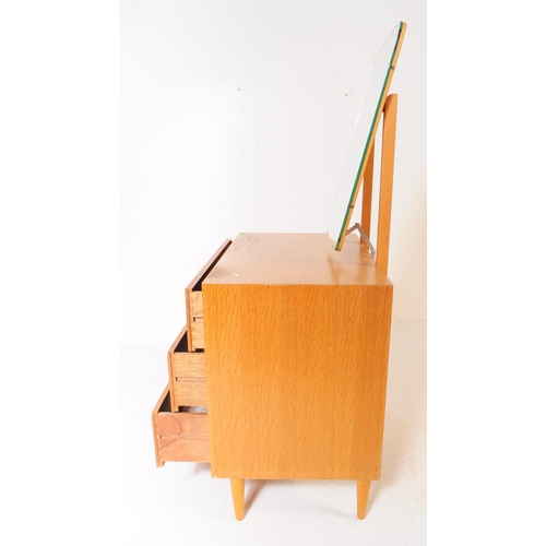 600 - Meredew - A vintage 1960's 20th century oak veneered dressing table / chest / drawers by Meredew. Or... 