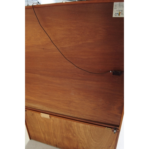 601 - A retro 20th century British designed teak upright high cabinet / display bookcase. Part open bookca... 