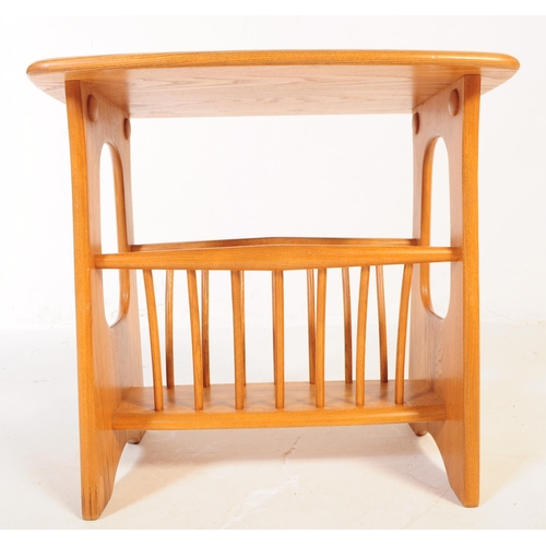 602 - ERCOL - A late 20th century Ercol beech wood magazine rack / table in the Chaucer range / pattern. R... 