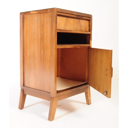 605 - An early to mid century oak wood side table together with an art deco walnut veneer bedside cabinet.... 