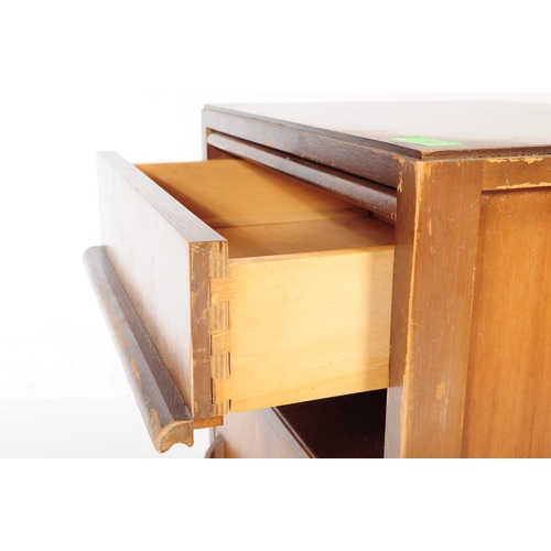 605 - An early to mid century oak wood side table together with an art deco walnut veneer bedside cabinet.... 