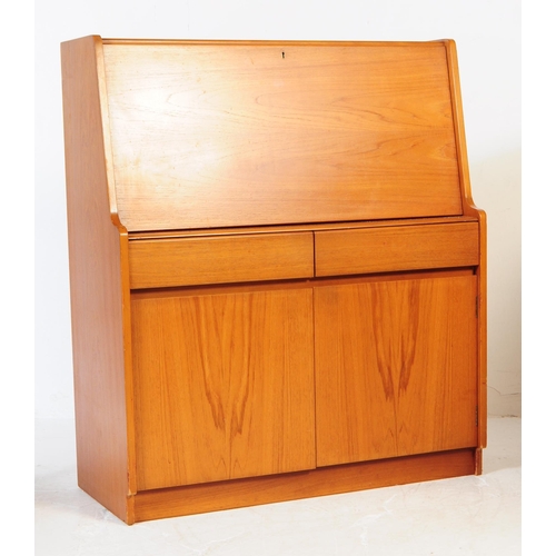 615 - Remploy - A mid 20th century teak wood bureau desk. Of rectangular form with pull down front cabinet... 