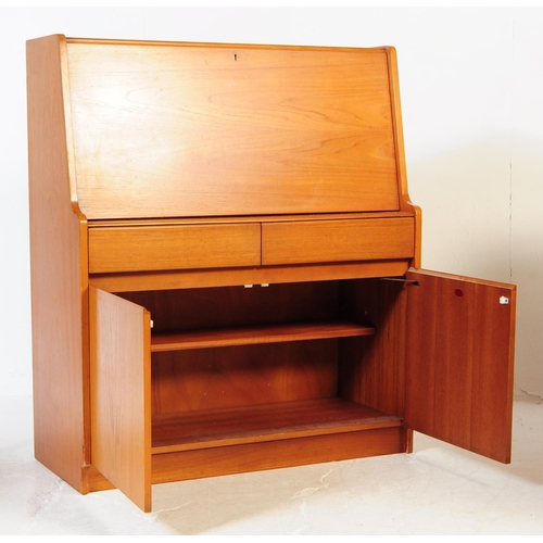 615 - Remploy - A mid 20th century teak wood bureau desk. Of rectangular form with pull down front cabinet... 