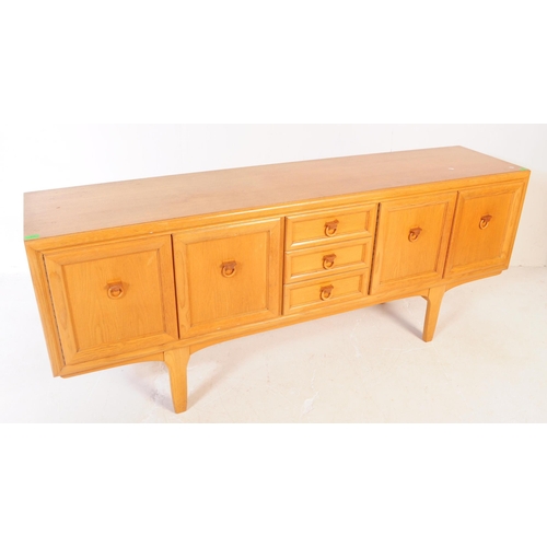 621 - Elliotts of Newbury - A mid 20th century EON teak wood sideboard credenza. The sideboard having a se... 