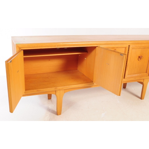 621 - Elliotts of Newbury - A mid 20th century EON teak wood sideboard credenza. The sideboard having a se... 