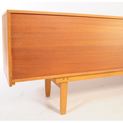 621 - Elliotts of Newbury - A mid 20th century EON teak wood sideboard credenza. The sideboard having a se... 