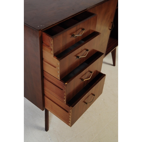 624 - A mid 20th century walnut veneer sideboard credenza. The sideboard raised on tapered wooden legs, wi... 