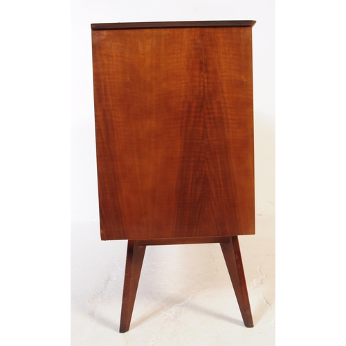 624 - A mid 20th century walnut veneer sideboard credenza. The sideboard raised on tapered wooden legs, wi... 