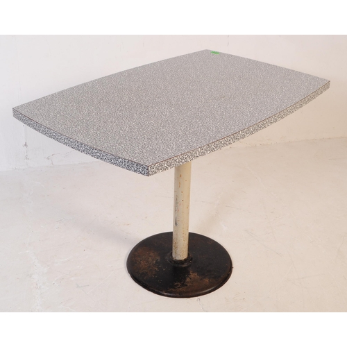 629 - A mid 20th century formica topped kitchen dining table. The table raised on a tubular central column... 