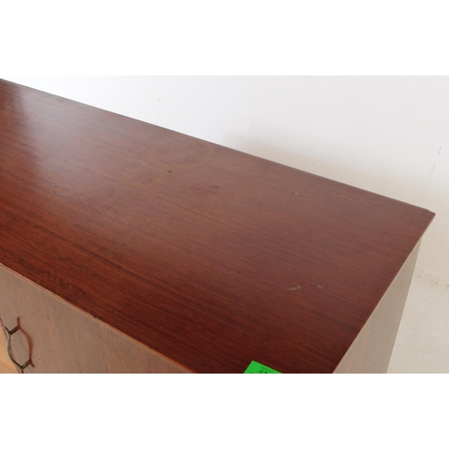 630 - A vintage mid 20th century teak veneer sideboard credenza. The sideboard having two cupboard doors f... 