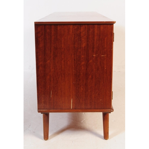 630 - A vintage mid 20th century teak veneer sideboard credenza. The sideboard having two cupboard doors f... 