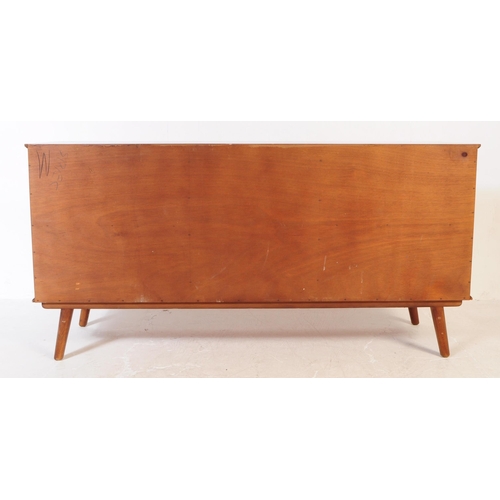 630 - A vintage mid 20th century teak veneer sideboard credenza. The sideboard having two cupboard doors f... 