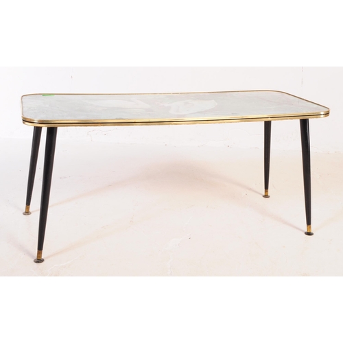 631 - A mid-century / retro 1960's glass top coffee table with dansette legs.  This vintage coffee table f... 