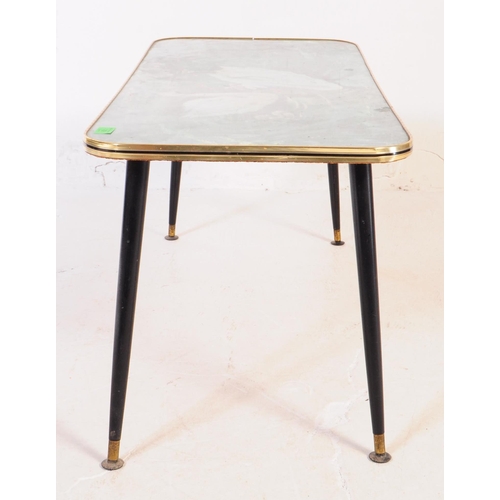 631 - A mid-century / retro 1960's glass top coffee table with dansette legs.  This vintage coffee table f... 