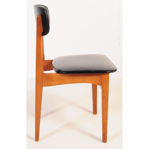 632 - A set of four mid 20th century circa 1960s teak Danish inspired dining chairs. The chairs each havin... 