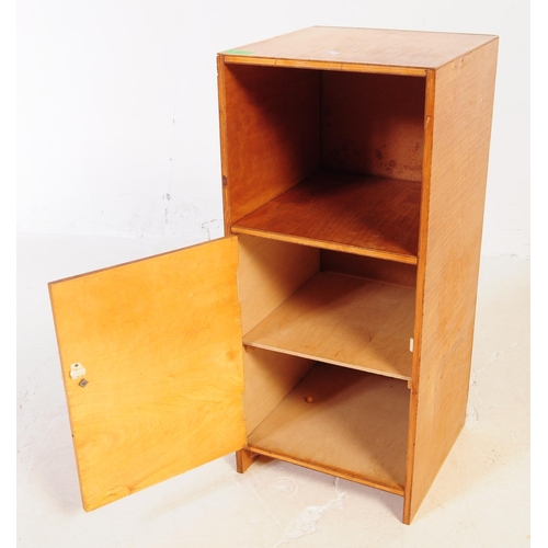 634 - A collection of three mid 20th century plywood bedside table / cupboards. The bedsides each featurin... 