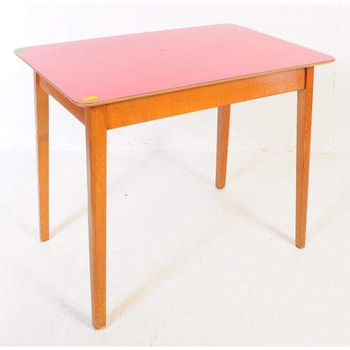 638 - A mid 20th century formica topped kitchen dining table and two stools. The table of rectangular form... 