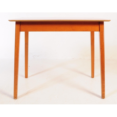 638 - A mid 20th century formica topped kitchen dining table and two stools. The table of rectangular form... 