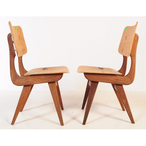 646 - Pair of vintage 20th century Danish manner teak dining chairs. With panel back rest and seat, curved... 