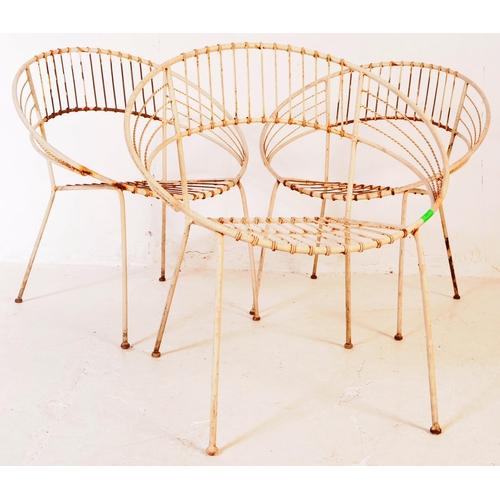 647 - A group of three vintage 20th century wire work satellite / egg chairs. Of round form with elbow res... 