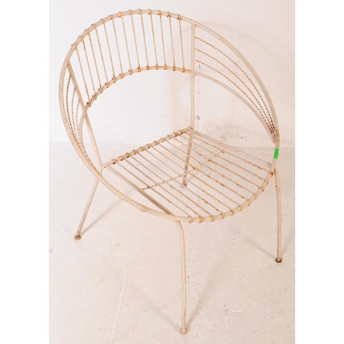 647 - A group of three vintage 20th century wire work satellite / egg chairs. Of round form with elbow res... 