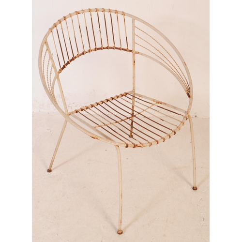 647 - A group of three vintage 20th century wire work satellite / egg chairs. Of round form with elbow res... 