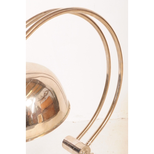 648 - Andrew Martin - A mid 20th century Andrew Martin industrial chromed metal table lamp. The lamp sat o... 