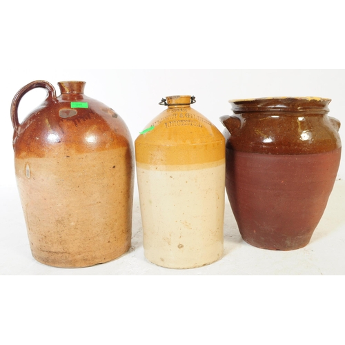 649 - Three early 20th century stoneware flagons / vase. All three in various earth tones, treacle glazes ... 