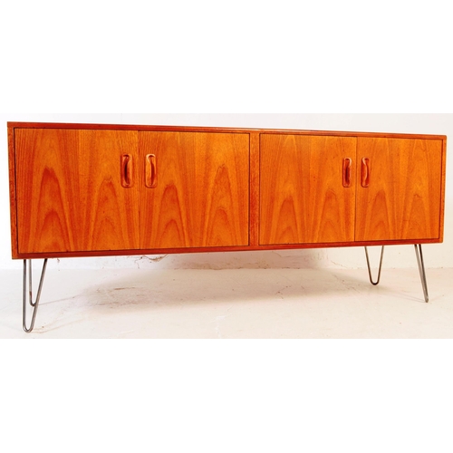 651 - G-Plan - A mid 20th century teak wood G Plan sideboard. The sideboard having two double door cupboar... 