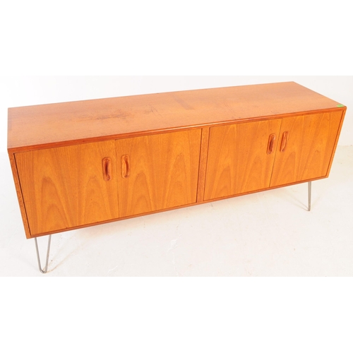 651 - G-Plan - A mid 20th century teak wood G Plan sideboard. The sideboard having two double door cupboar... 