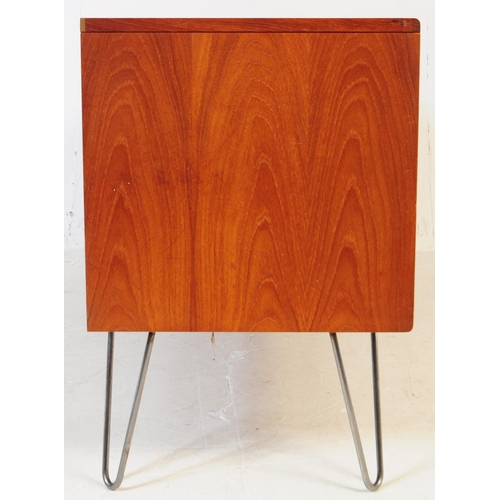 651 - G-Plan - A mid 20th century teak wood G Plan sideboard. The sideboard having two double door cupboar... 