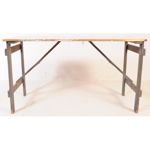 654 - A mid 20th century garden dining folding trestle table and chairs. The table painted in a white colo... 