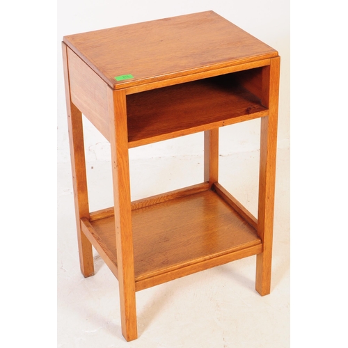 655 - A pair of mid 20th century Air Ministry manner oak bedside tables. The bedsides raised on four squar... 