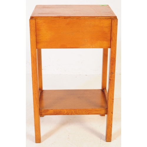 655 - A pair of mid 20th century Air Ministry manner oak bedside tables. The bedsides raised on four squar... 