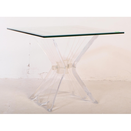 658 - A mid 20th century lucite and glass butterfly coffee table. The table having a square glass top with... 