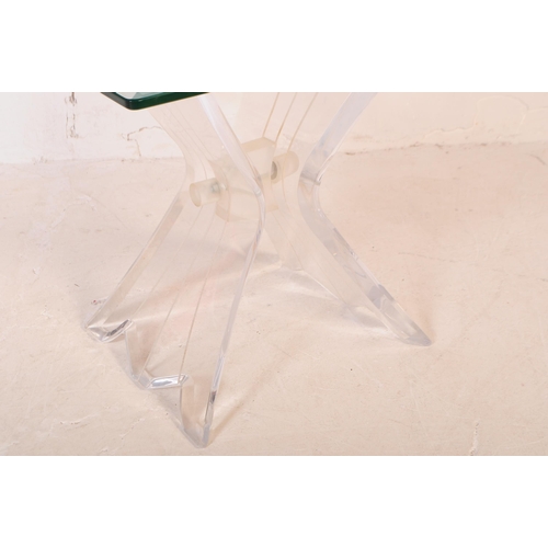 658 - A mid 20th century lucite and glass butterfly coffee table. The table having a square glass top with... 