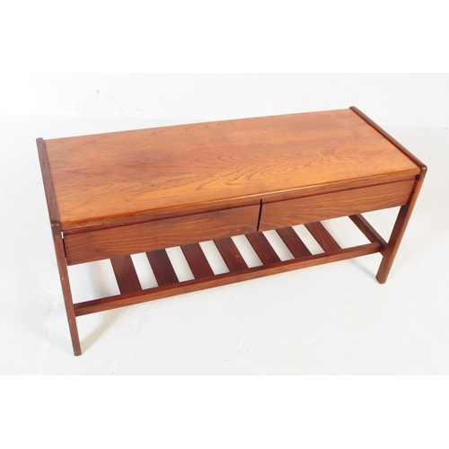 661 - Meredew - A mid 20th century Meredew teak wood coffee table. The table of rectangular form with roun... 