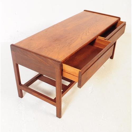 661 - Meredew - A mid 20th century Meredew teak wood coffee table. The table of rectangular form with roun... 