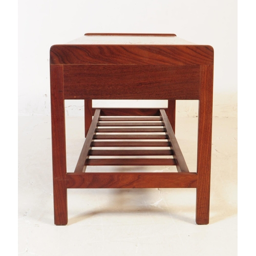 661 - Meredew - A mid 20th century Meredew teak wood coffee table. The table of rectangular form with roun... 