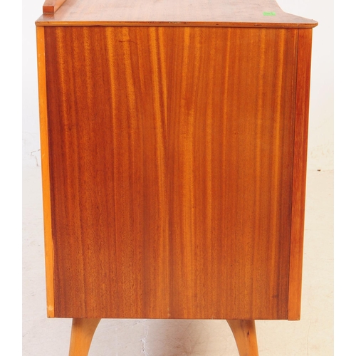 665 - Austinsuite - A mid 20th century circa. 1960's Austinsuite teak veneer chest of drawers. The bank of... 