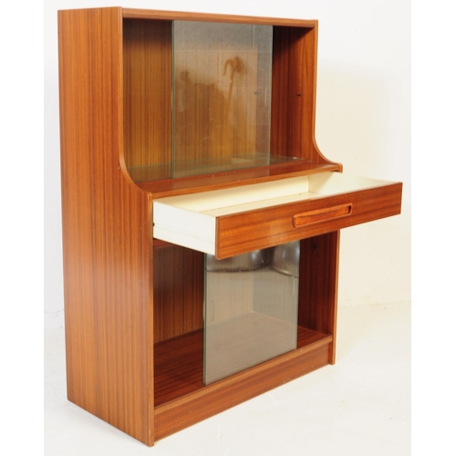 666 - Avalon - A mid 20th century Avalon teak veneer glazed bookcase display cabinet. The cabinet having t... 