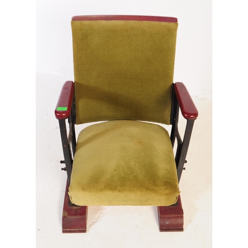 667 - A mid 20th century single cinema / theatre audience chair. The chair having a folding seat suspended... 