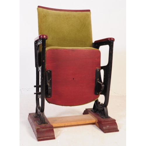 667 - A mid 20th century single cinema / theatre audience chair. The chair having a folding seat suspended... 