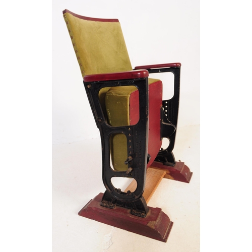 667 - A mid 20th century single cinema / theatre audience chair. The chair having a folding seat suspended... 