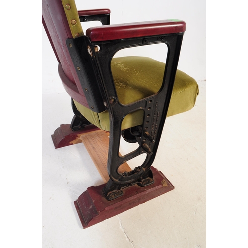 667 - A mid 20th century single cinema / theatre audience chair. The chair having a folding seat suspended... 