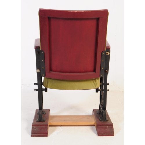 667 - A mid 20th century single cinema / theatre audience chair. The chair having a folding seat suspended... 