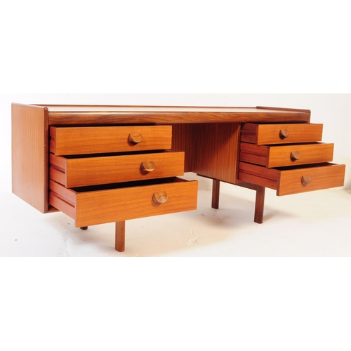 669 - White and Newton - A mid 20th century circa 1960s teak wood dressing table desk. The desk of rectang... 