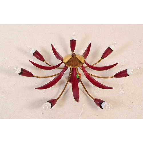 671 - A mid 20th century sputnik manner spider ceiling light / lamp. The light featuring seven arms extend... 